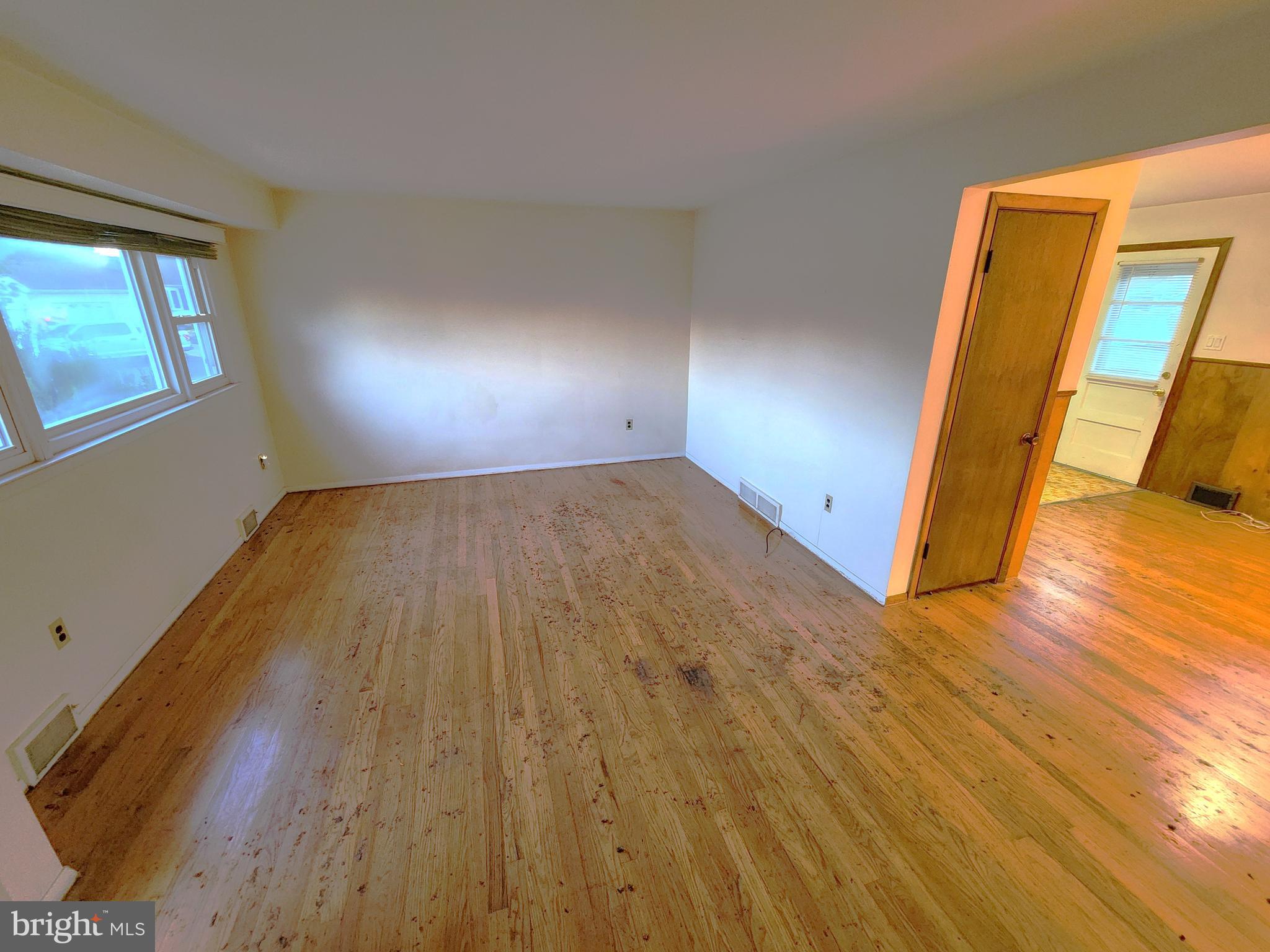 7 Saranac Road Hamilton, NJ 08619 - Photo 7 of 19 wooden floor in an empty room with a window