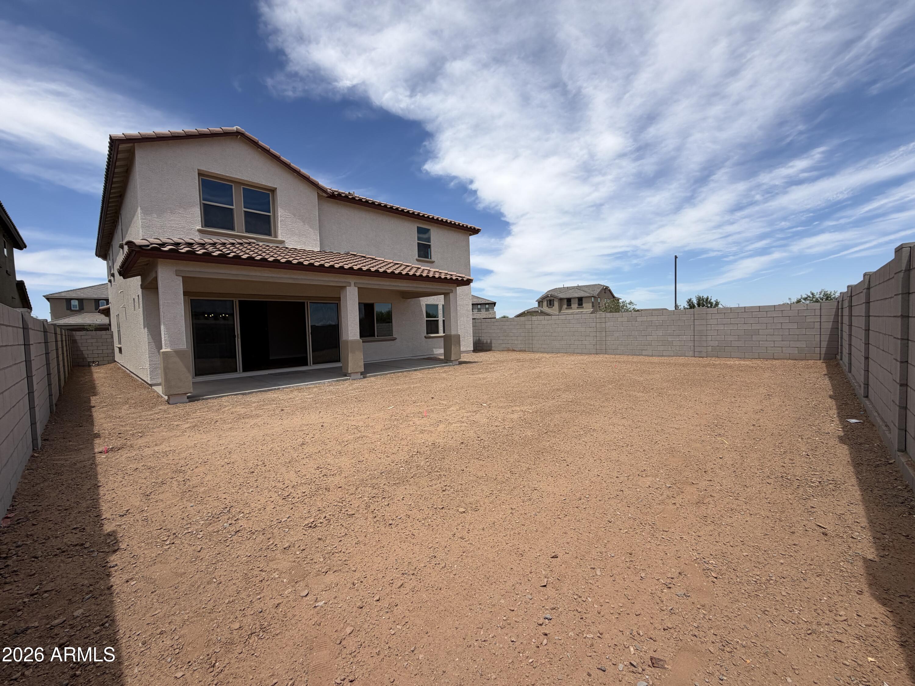 15767 West Sand Hills Road Surprise, AZ 85387 - Photo 12 of 60 a front view of a house with a yard and garage