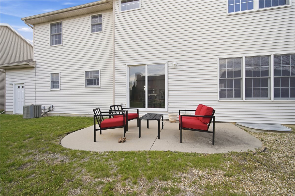 3255 Fire Fly Court Normal, IL 61761 - Photo 23 of 25 a backyard of a house with fire pit and chairs