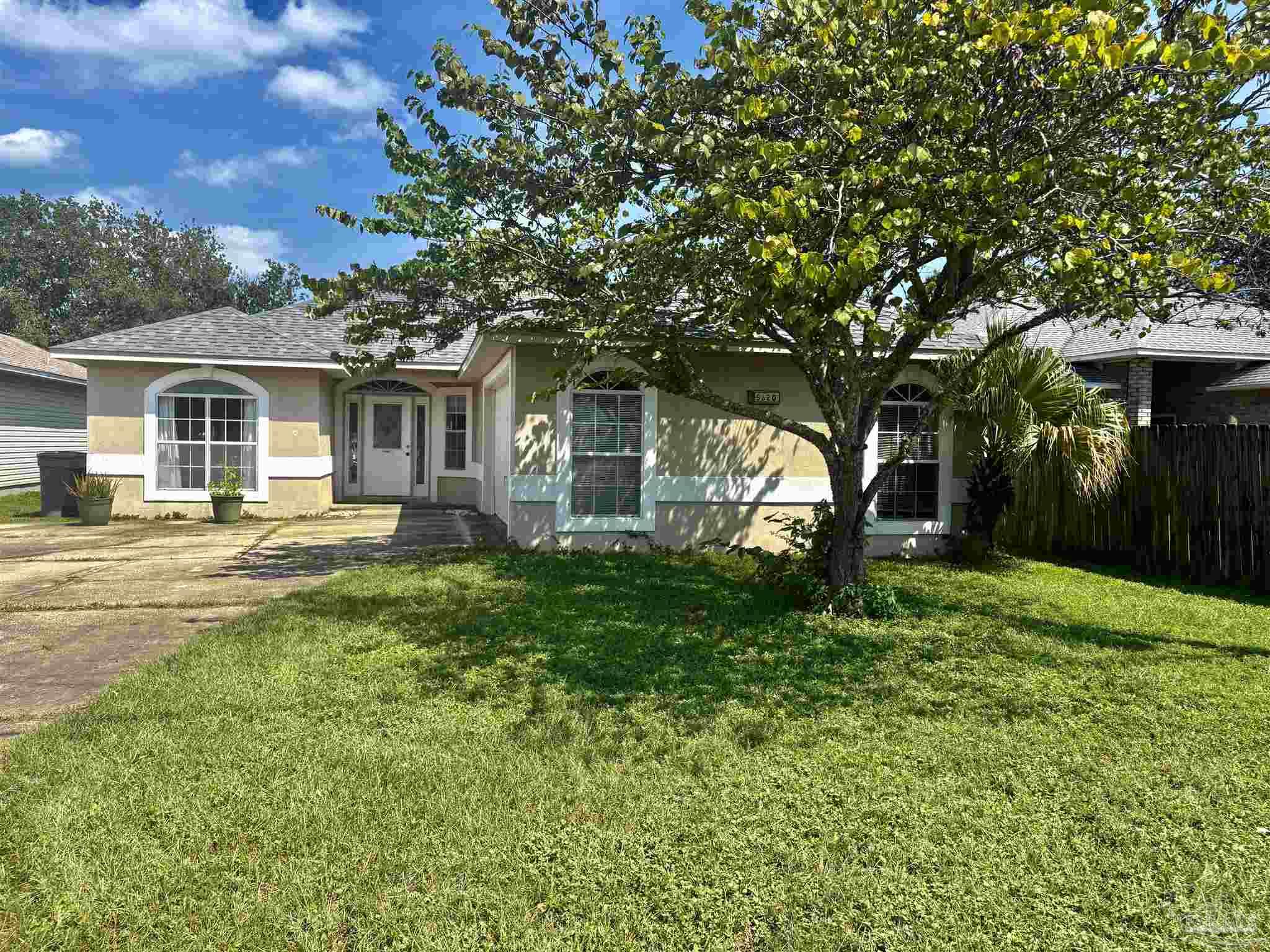 5620 Bauer Road Pensacola, FL 32507 - Photo 1 of 2 a front view of a house with a yard