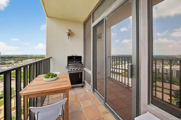 a view of a balcony with an outdoor space
