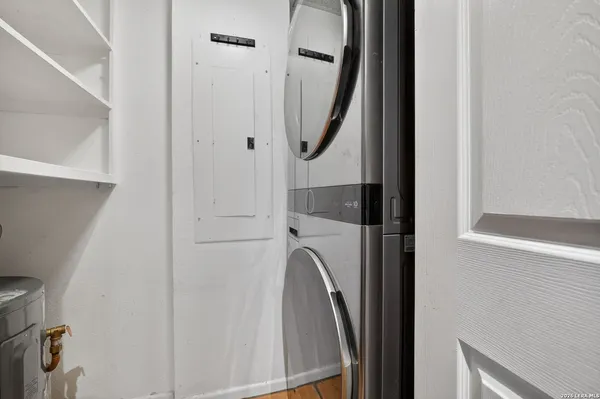a view of walk in closet with empty racks