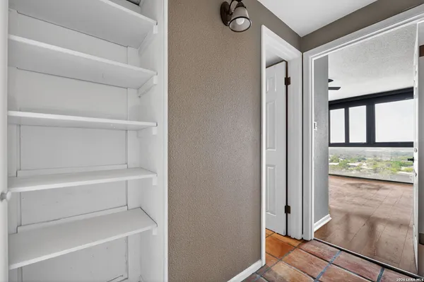 a bedroom with bed and window