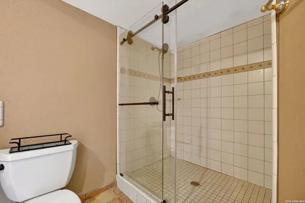 a spacious bathroom with a sink and mirror