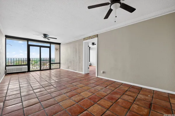 a view of an empty room and window