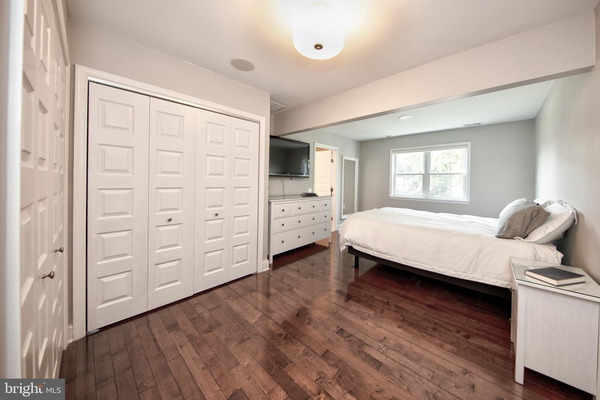 9315 Perglen Road Baltimore, MD 21236 - Photo 13 of 32 a bedroom with a bed and a dresser