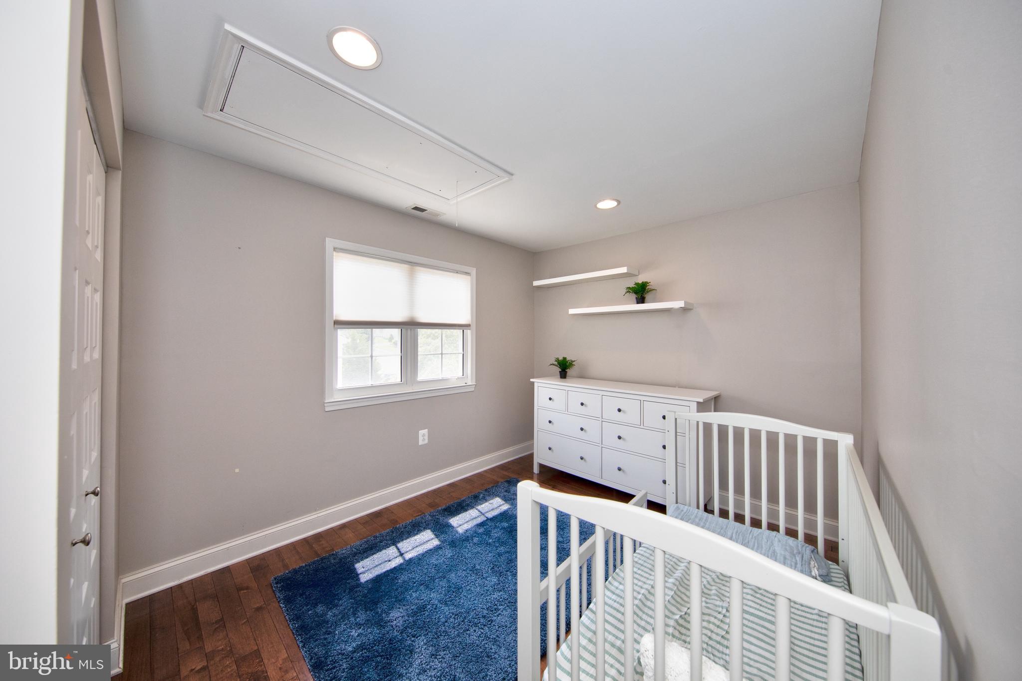 9315 Perglen Road Baltimore, MD 21236 - Photo 19 of 32 a bedroom with furniture and baby crib