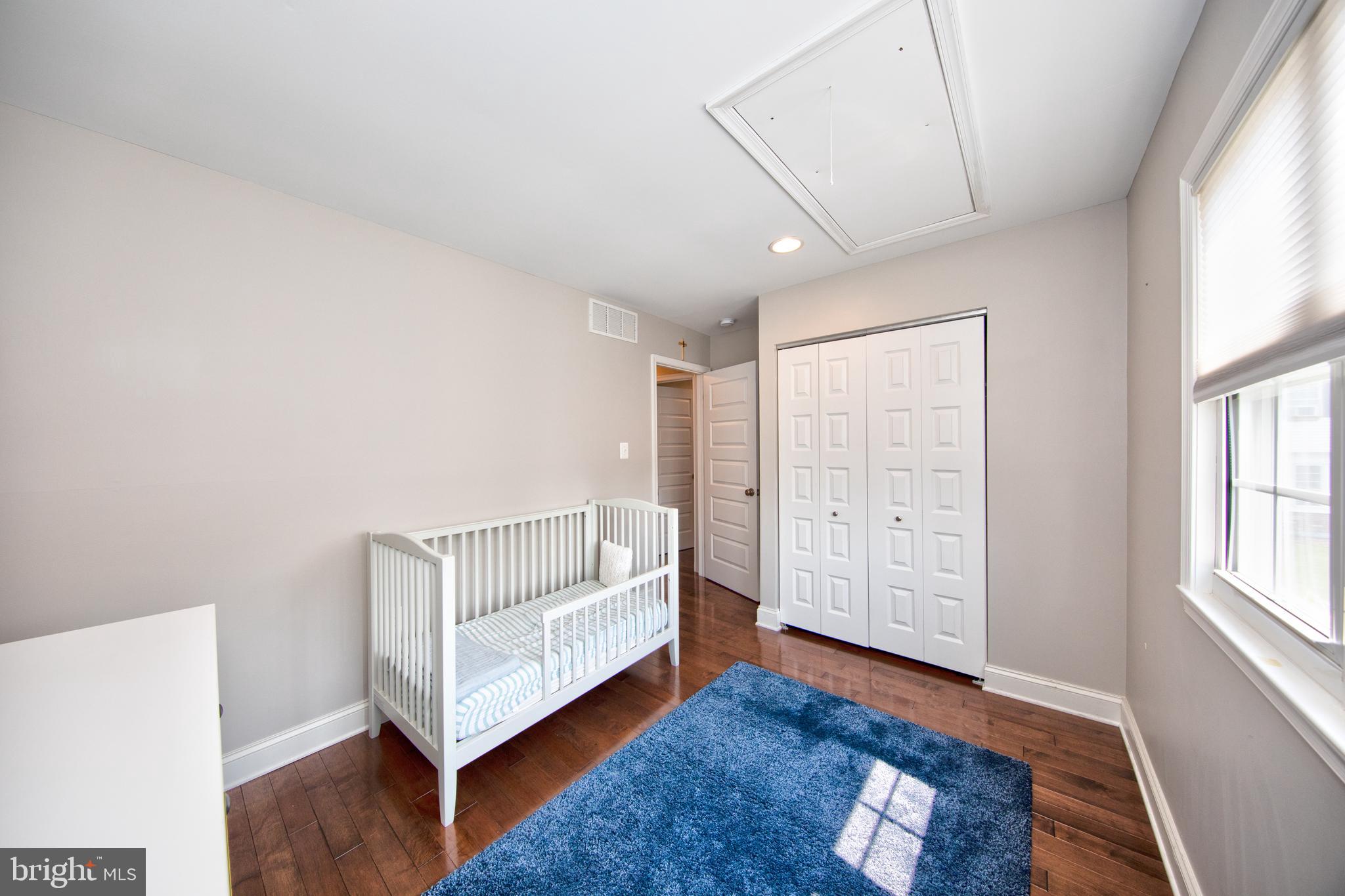 9315 Perglen Road Baltimore, MD 21236 - Photo 20 of 32 a spacious bedroom with a bed and a window