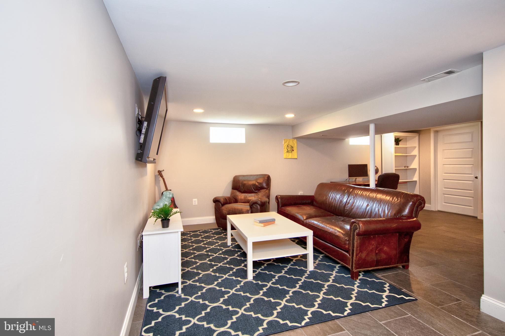 9315 Perglen Road Baltimore, MD 21236 - Photo 22 of 32 a living room with furniture and wooden floor