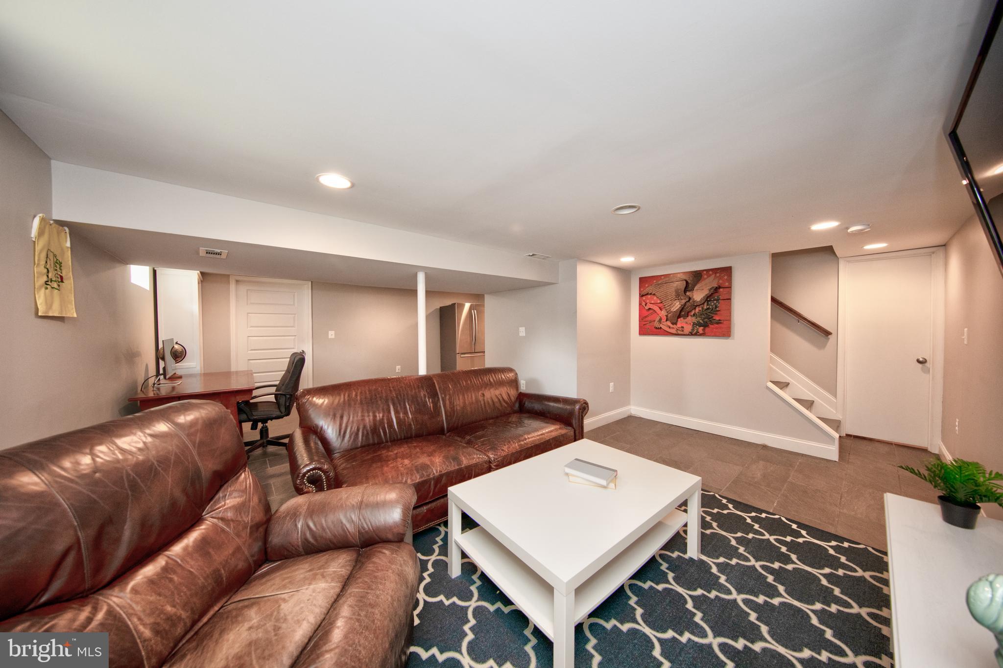 9315 Perglen Road Baltimore, MD 21236 - Photo 24 of 32 a living room with furniture and a rug