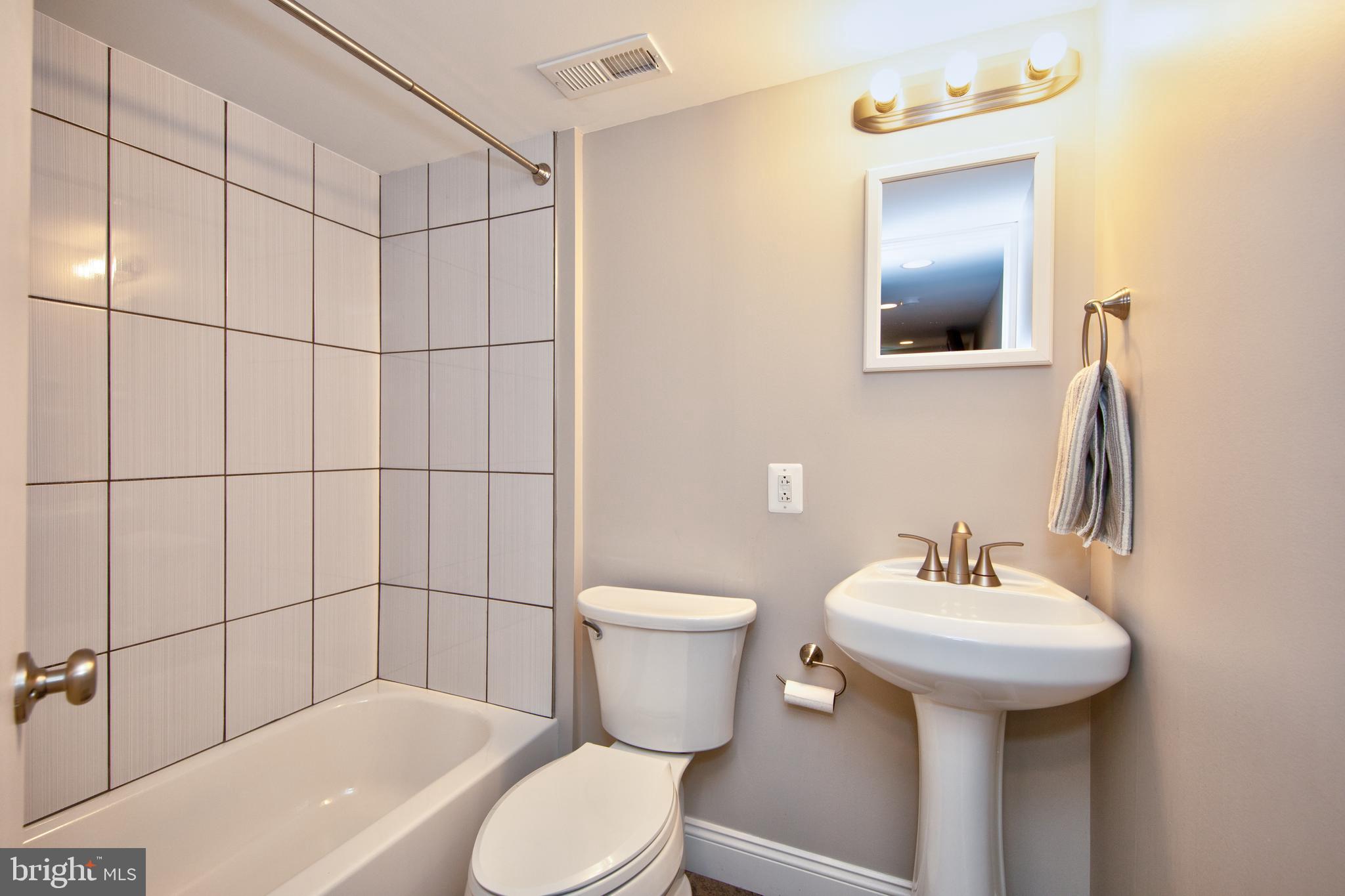 9315 Perglen Road Baltimore, MD 21236 - Photo 26 of 32 a bathroom with a sink toilet and shower