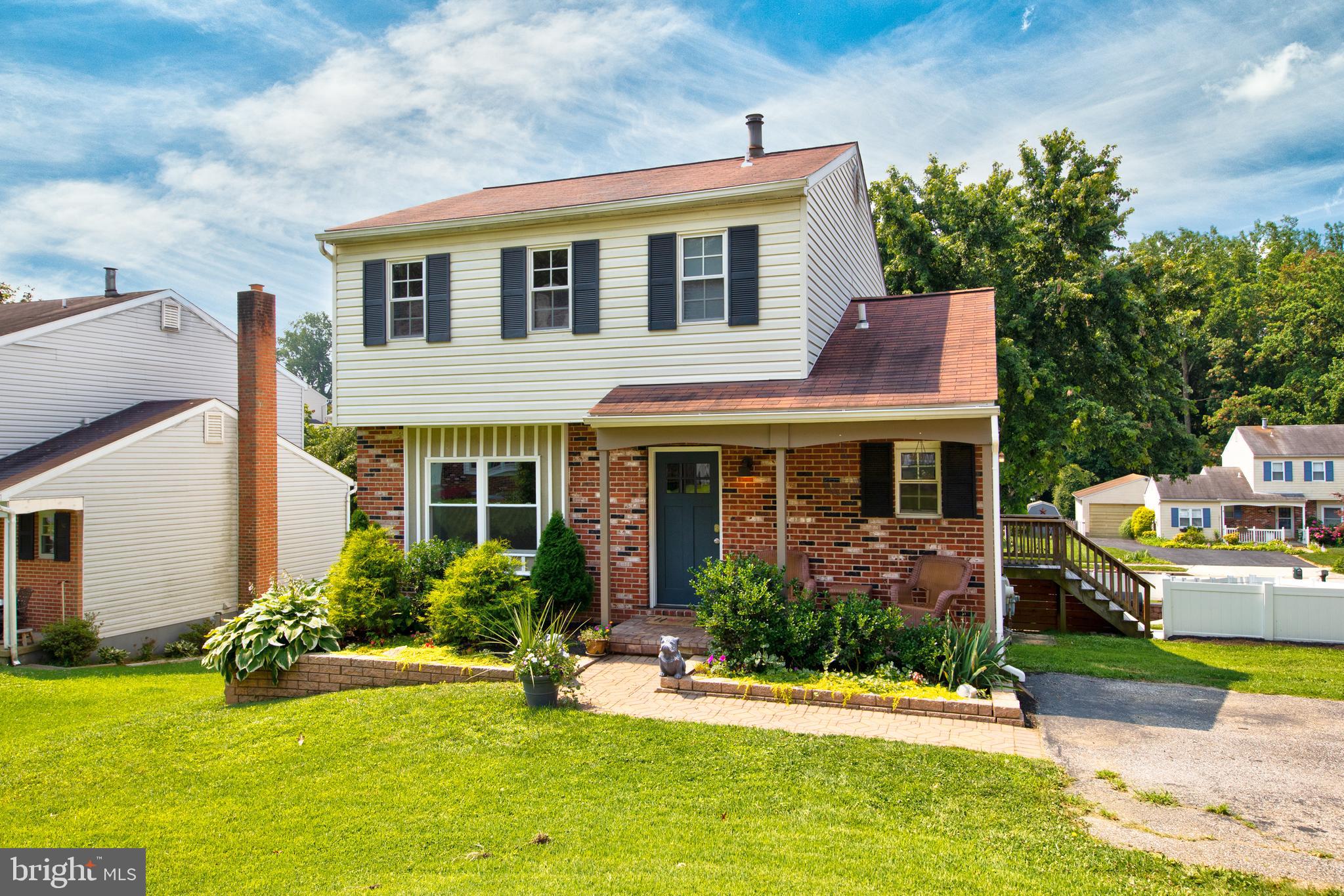 9315 Perglen Road Baltimore, MD 21236 - Photo 31 of 32 a front view of house with yard and green space