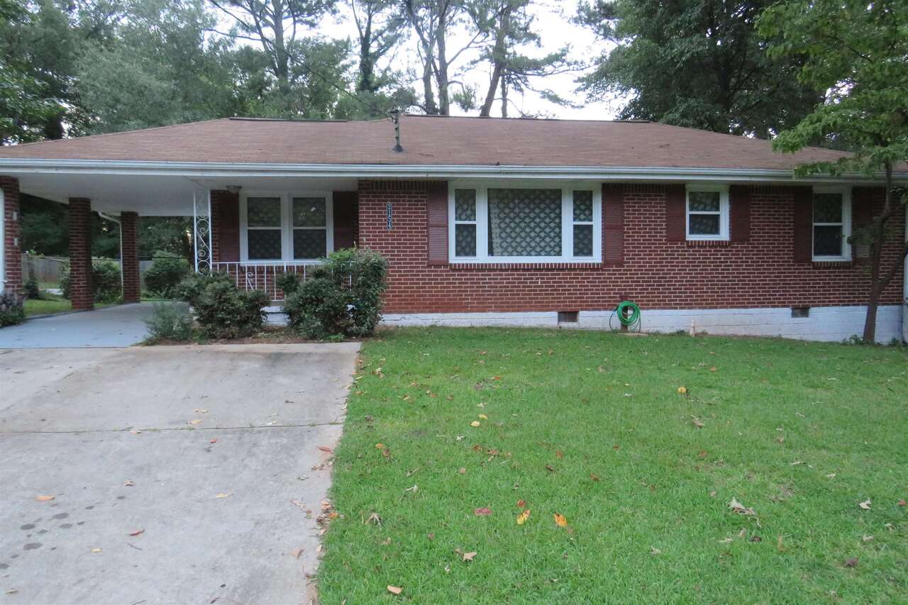 2154 Brannen Road Southeast Atlanta, GA 30316 - Photo 1 of 1 a front view of a house with a garden and yard
