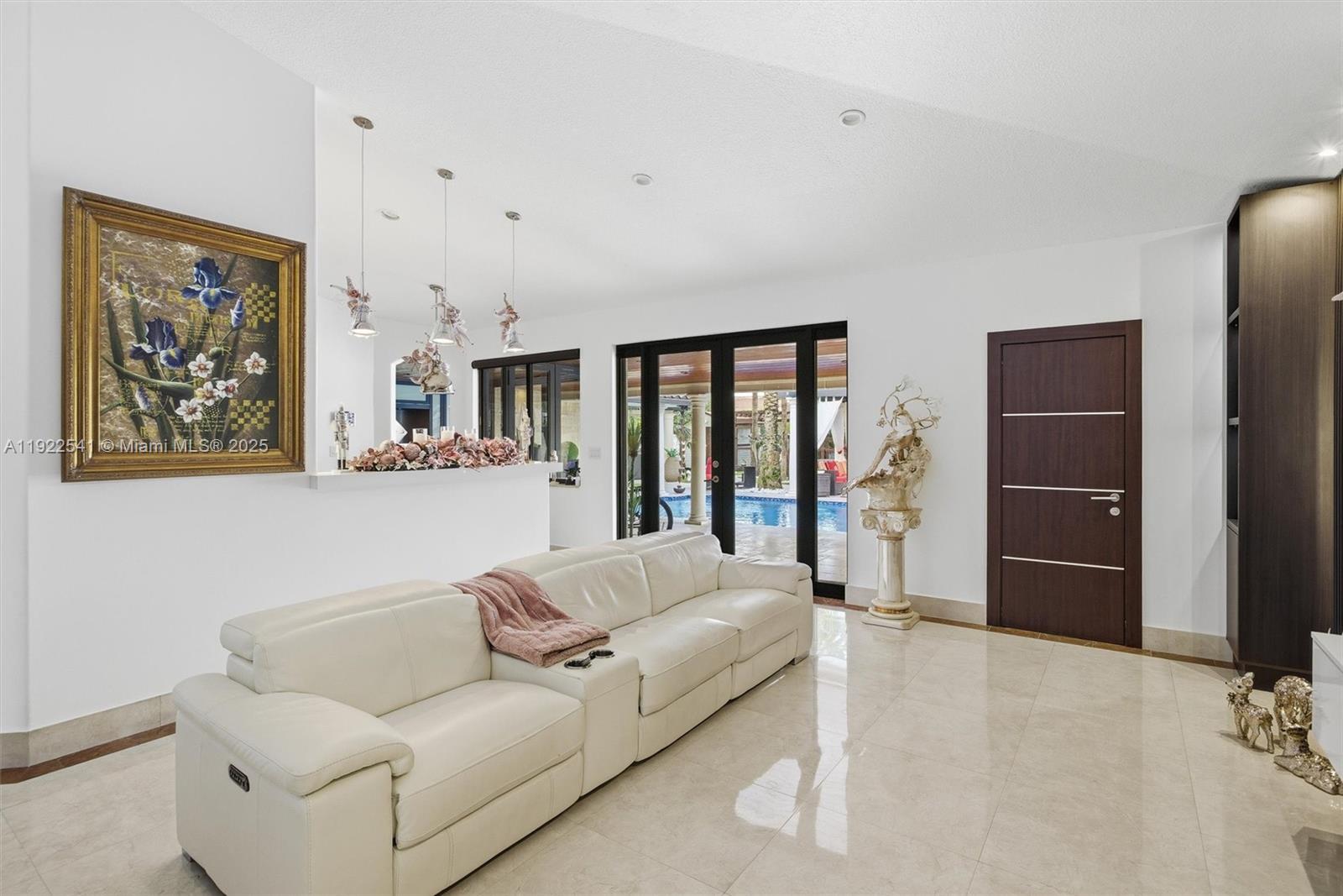 14252 Southwest 30th Street Miami, FL 33175 - Photo 12 of 60 a living room with furniture and a flat screen tv