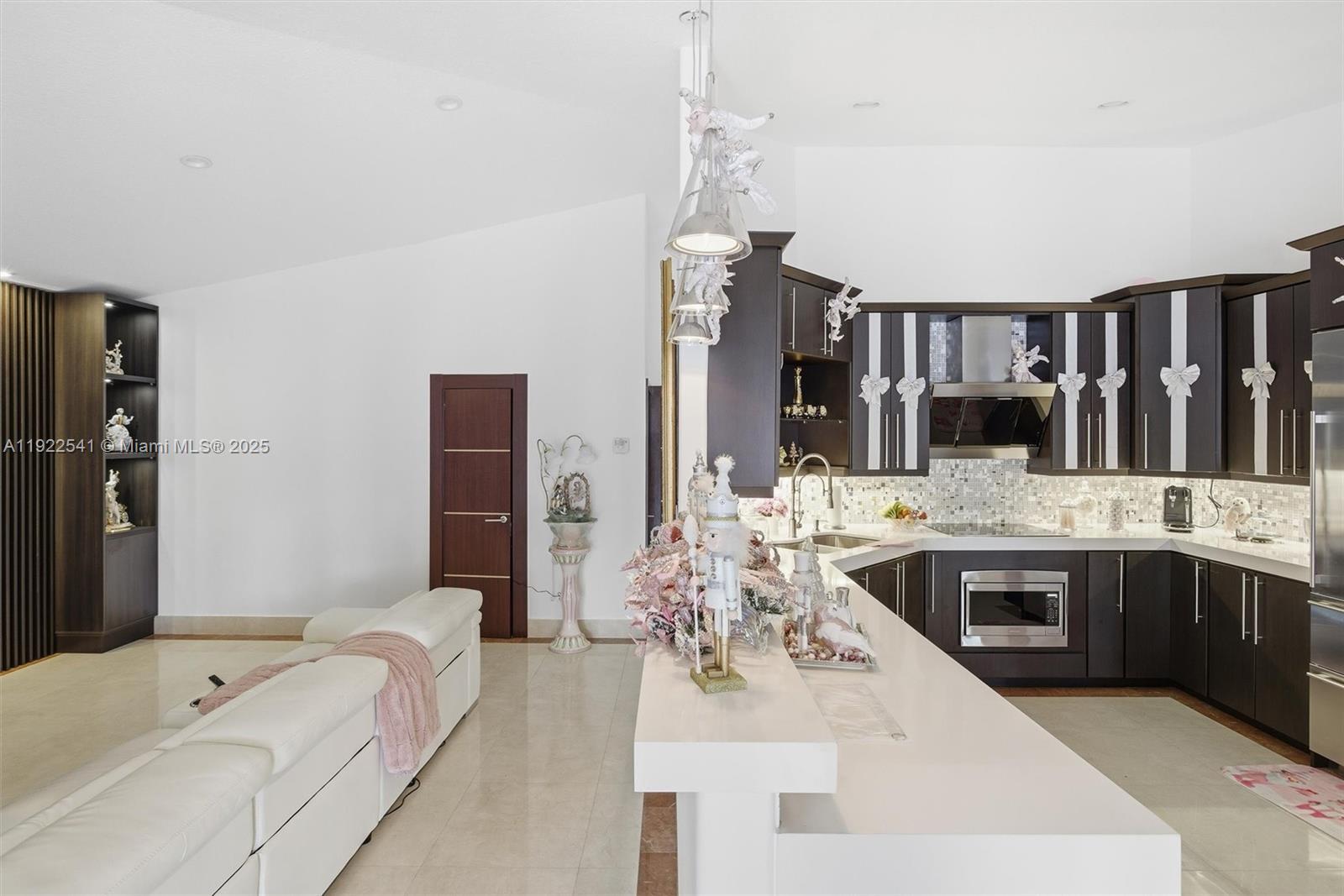 14252 Southwest 30th Street Miami, FL 33175 - Photo 15 of 60 a large white kitchen with a stove and large window