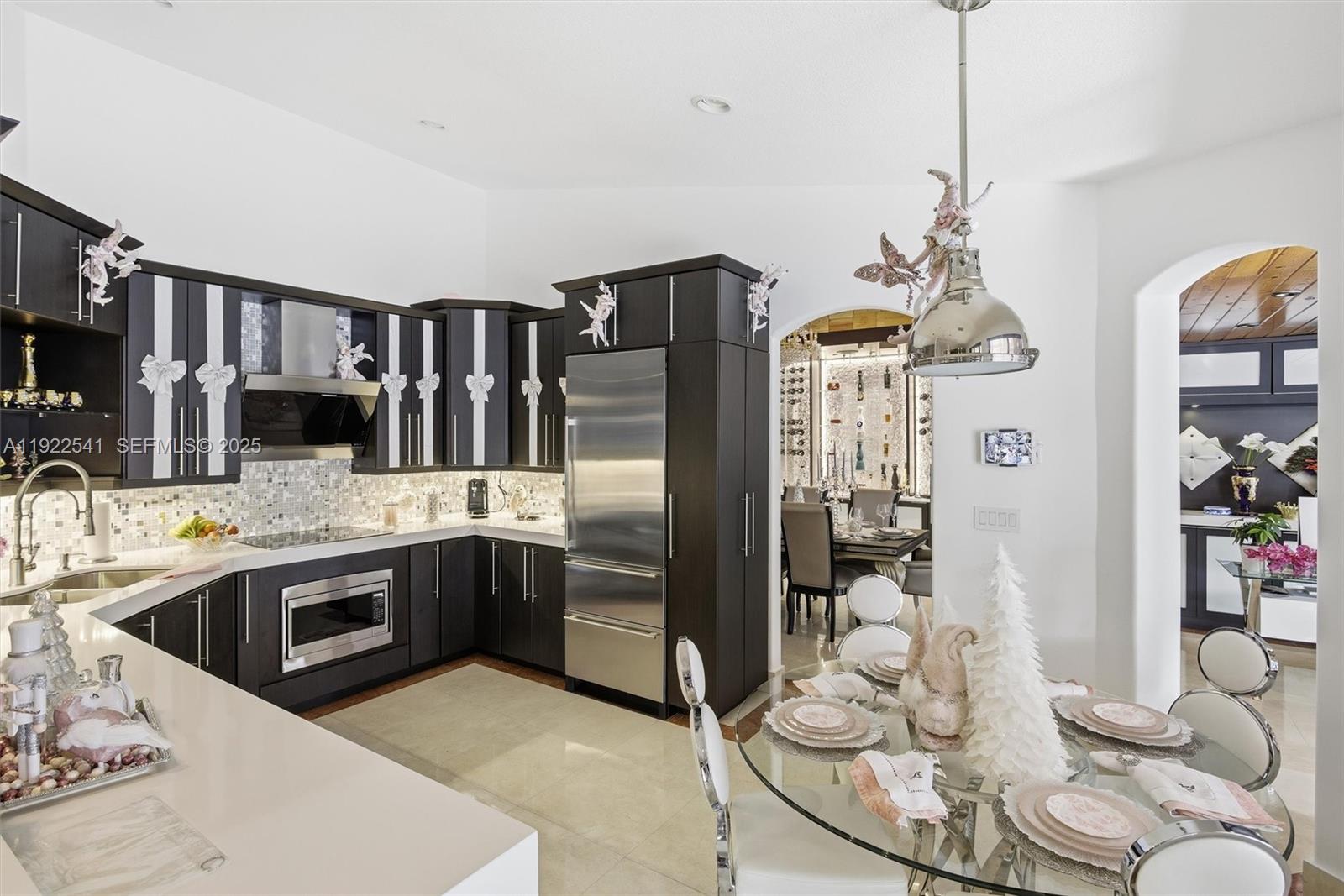 14252 Southwest 30th Street Miami, FL 33175 - Photo 16 of 60 a kitchen with stainless steel appliances granite countertop a sink and cabinets