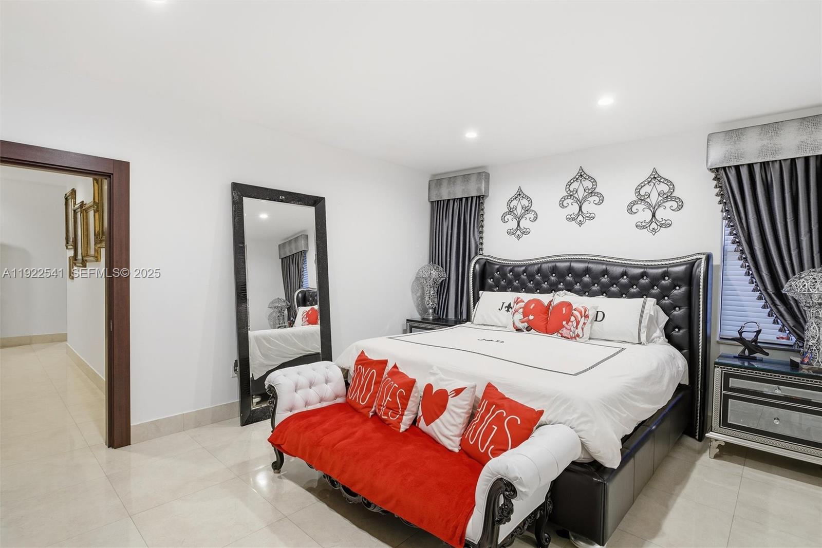 14252 Southwest 30th Street Miami, FL 33175 - Photo 22 of 60 a bedroom with a bed and a painting on the wall