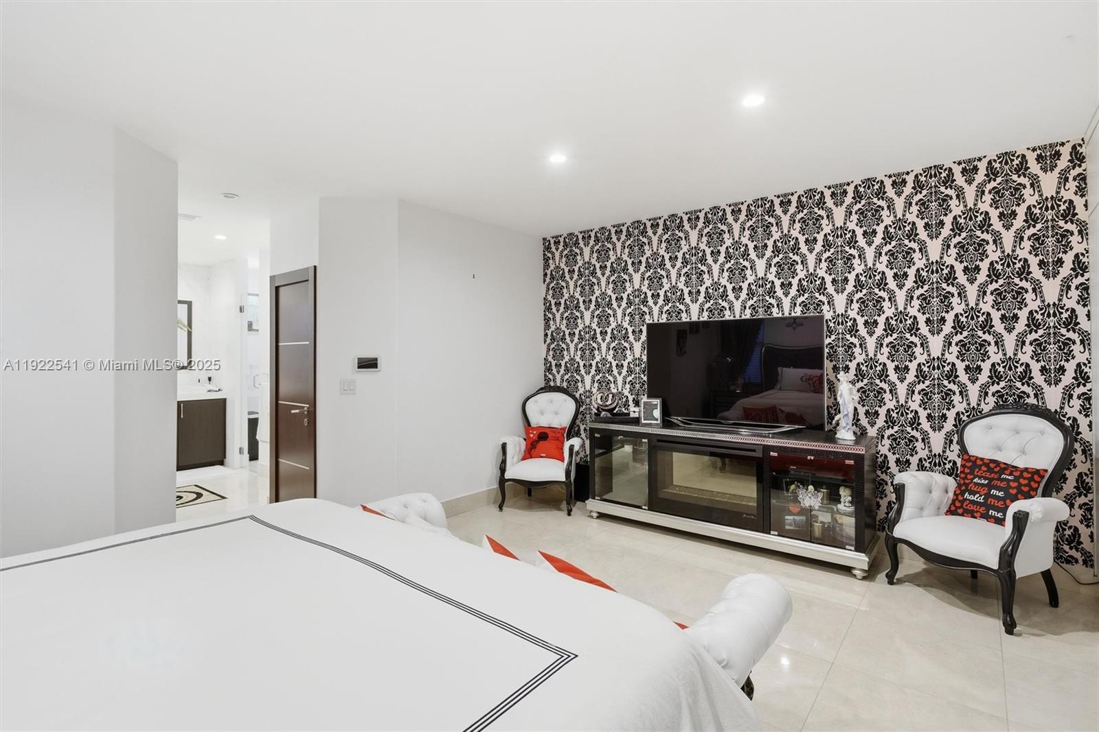 14252 Southwest 30th Street Miami, FL 33175 - Photo 23 of 60 a bedroom with bed and a flat screen tv