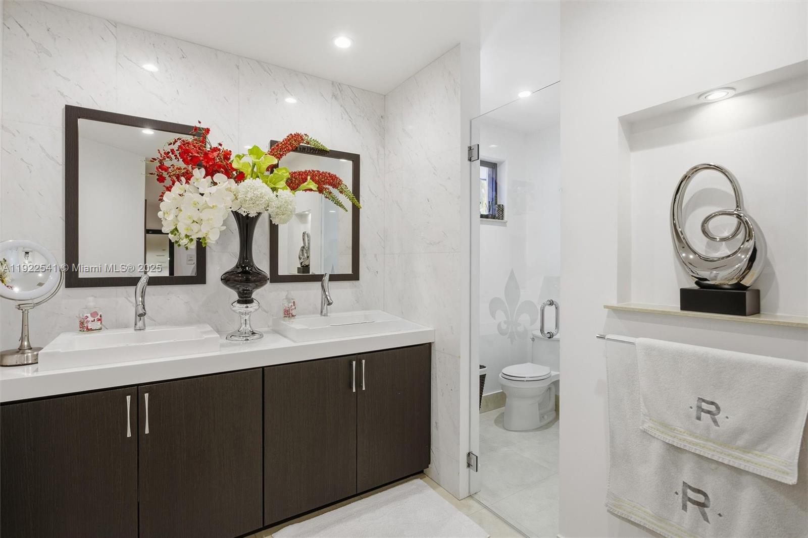 14252 Southwest 30th Street Miami, FL 33175 - Photo 27 of 60 a bathroom with a double vanity sink mirror and toilet