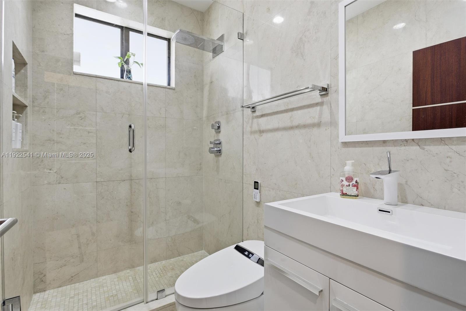 14252 Southwest 30th Street Miami, FL 33175 - Photo 30 of 60 a bathroom with a sink toilet and shower