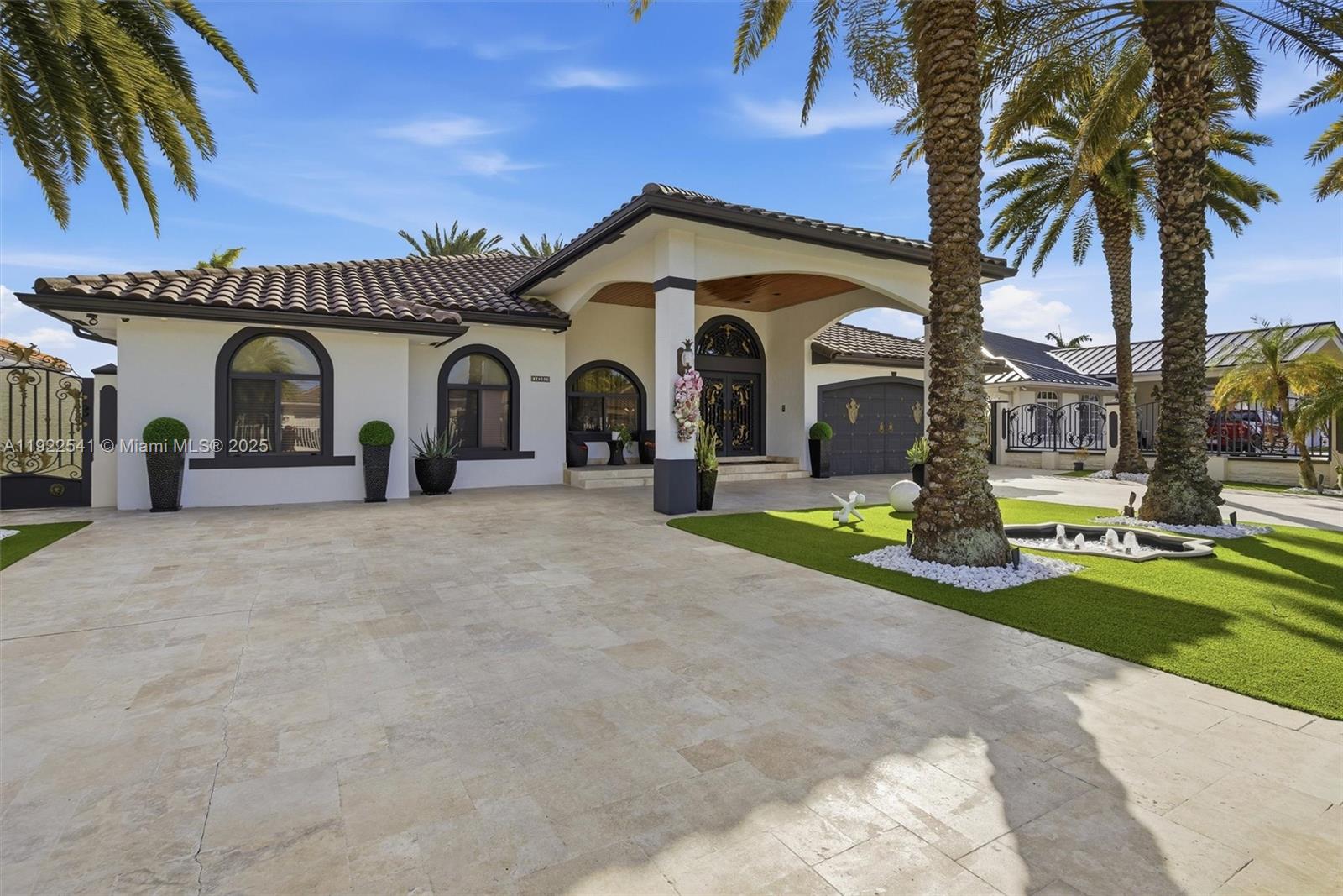 14252 Southwest 30th Street Miami, FL 33175 - Photo 3 of 60 a front view of a house with yard and garage