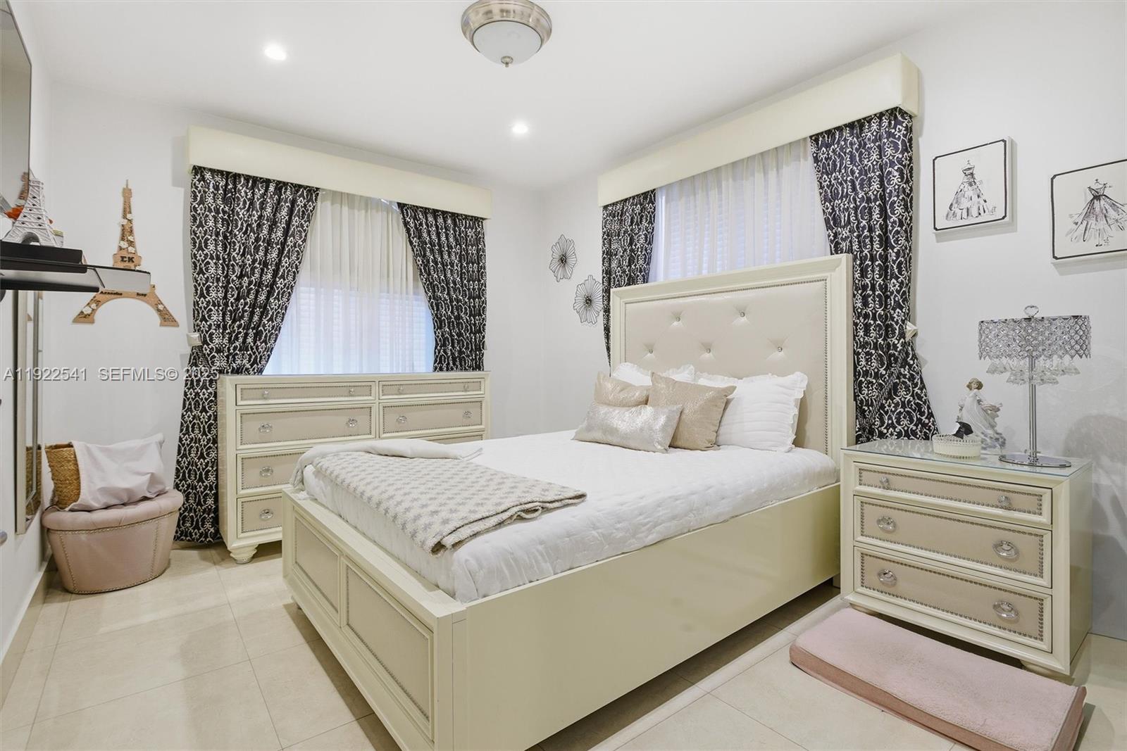 14252 Southwest 30th Street Miami, FL 33175 - Photo 31 of 60 a bedroom with a bed and a couch