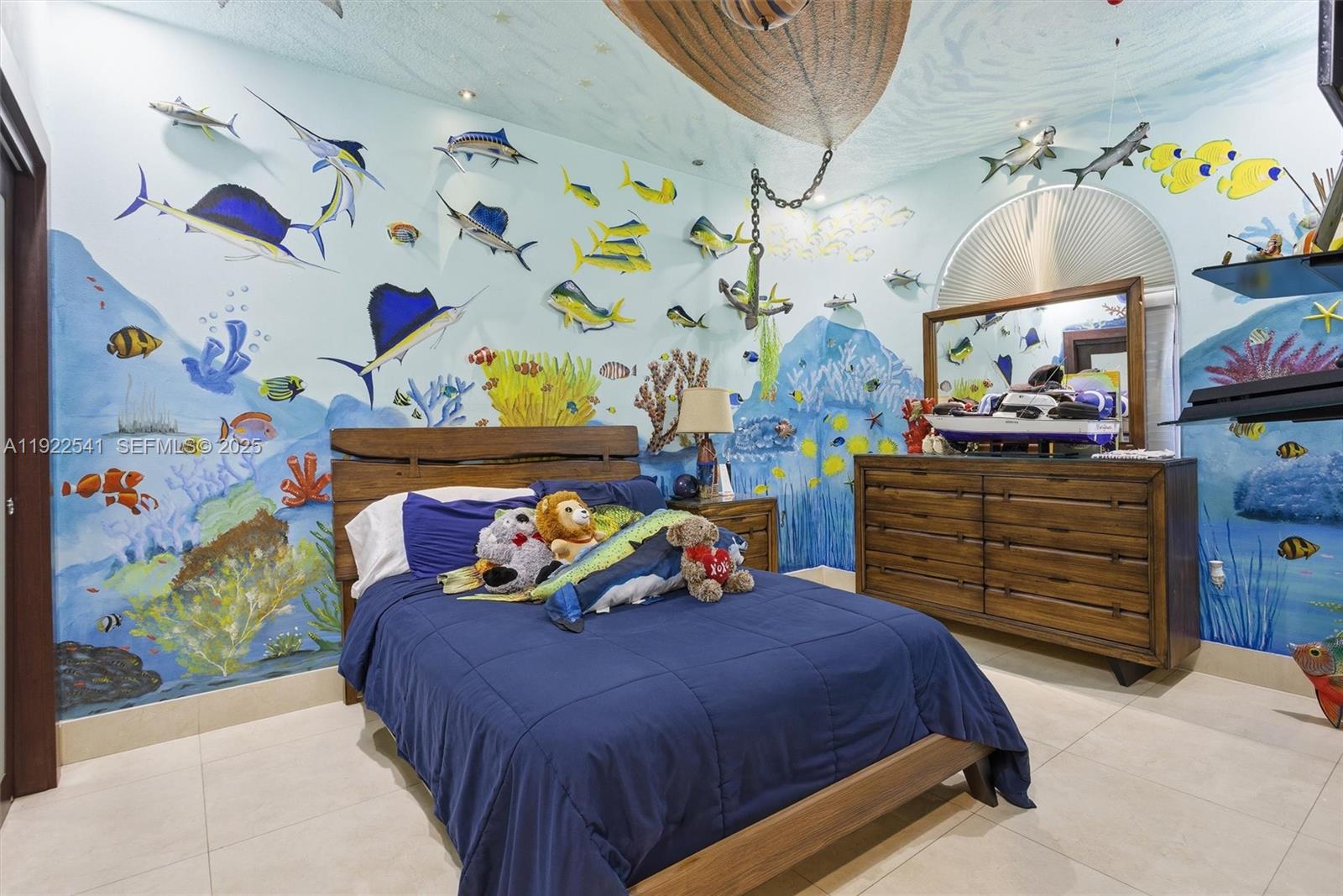 14252 Southwest 30th Street Miami, FL 33175 - Photo 32 of 60 a bed room with a bed and paintings on the wall