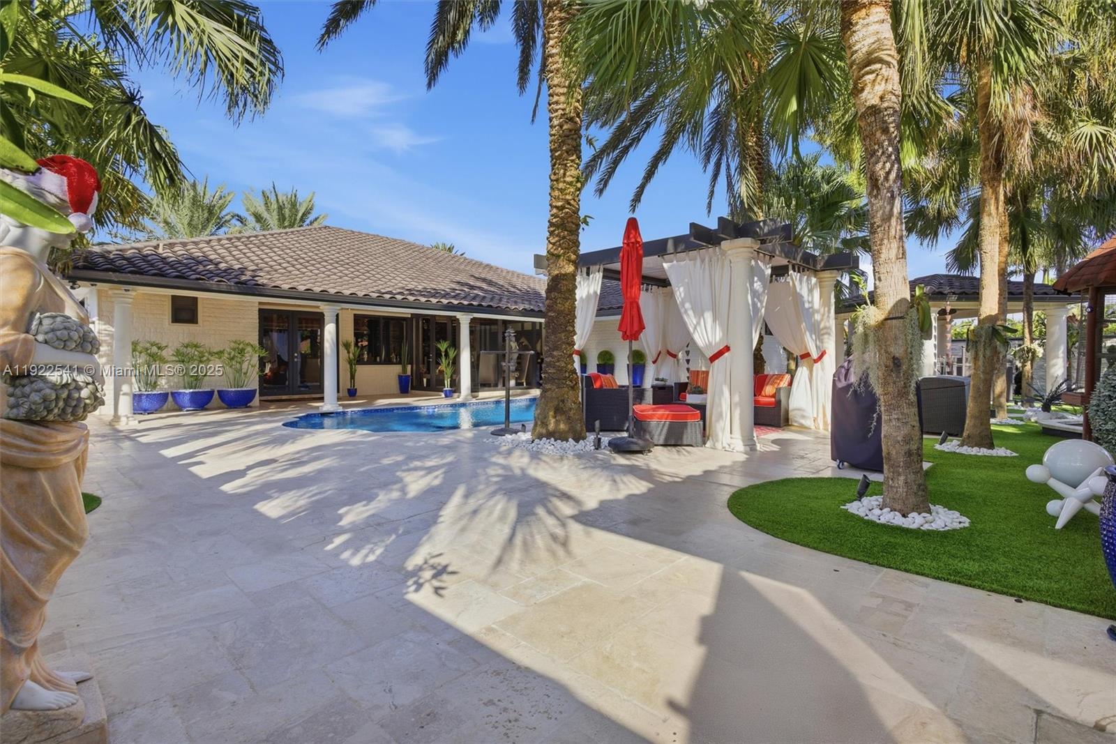 14252 Southwest 30th Street Miami, FL 33175 - Photo 38 of 60 a front view of multiple houses with yard and green space