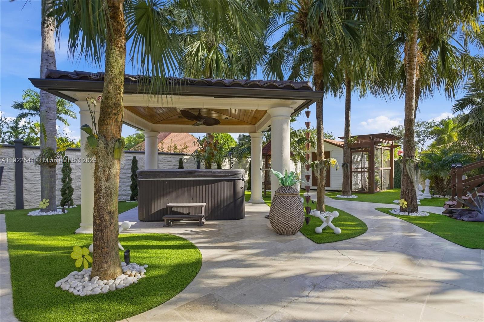 14252 Southwest 30th Street Miami, FL 33175 - Photo 44 of 60 a front view of a house with garden and trees