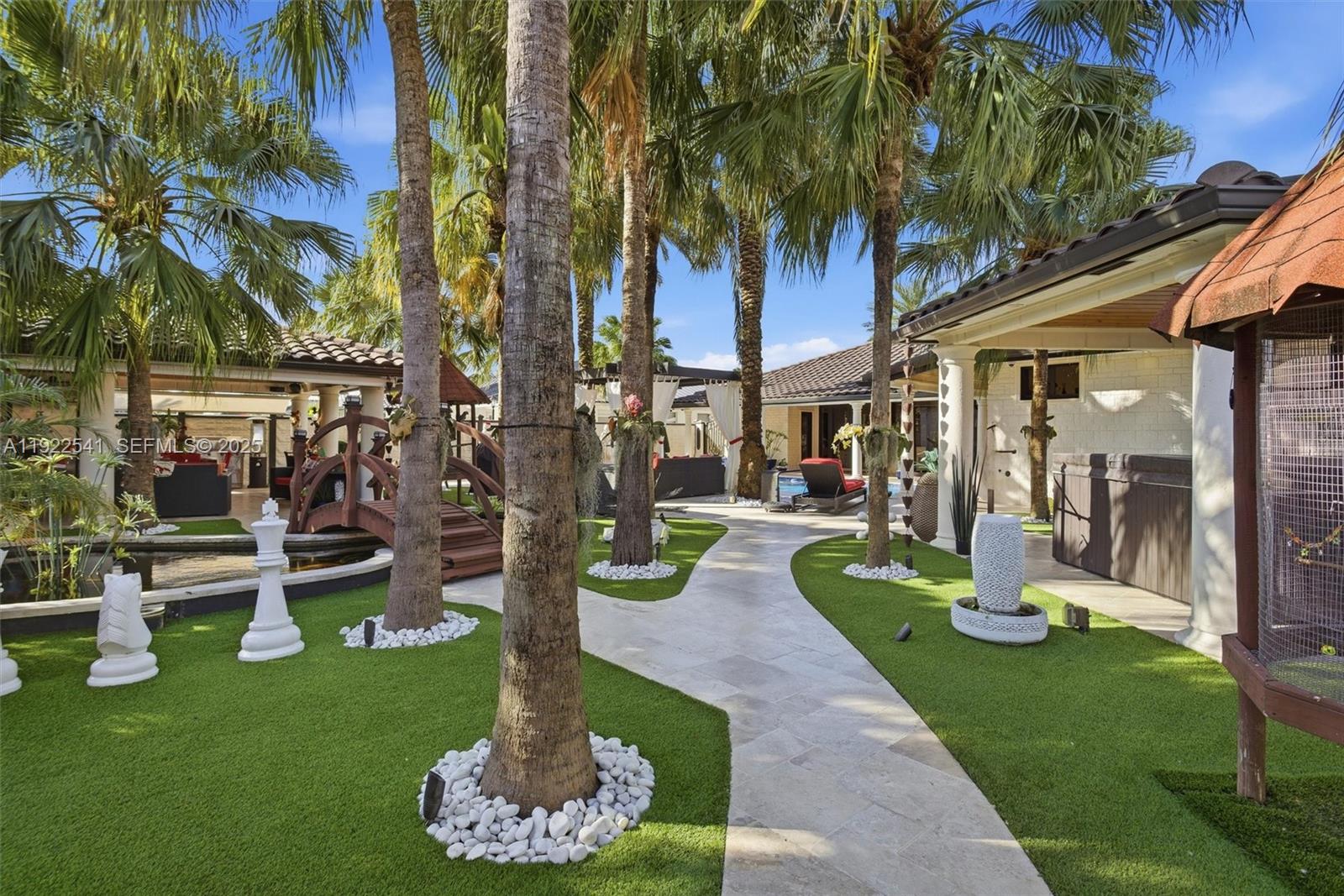 14252 Southwest 30th Street Miami, FL 33175 - Photo 46 of 60 a front view of a house with garden and sitting area