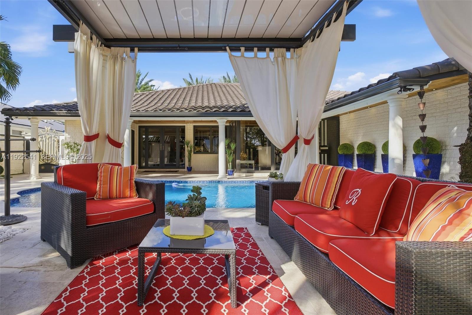 14252 Southwest 30th Street Miami, FL 33175 - Photo 47 of 60 a outdoor living space with furniture and a fireplace