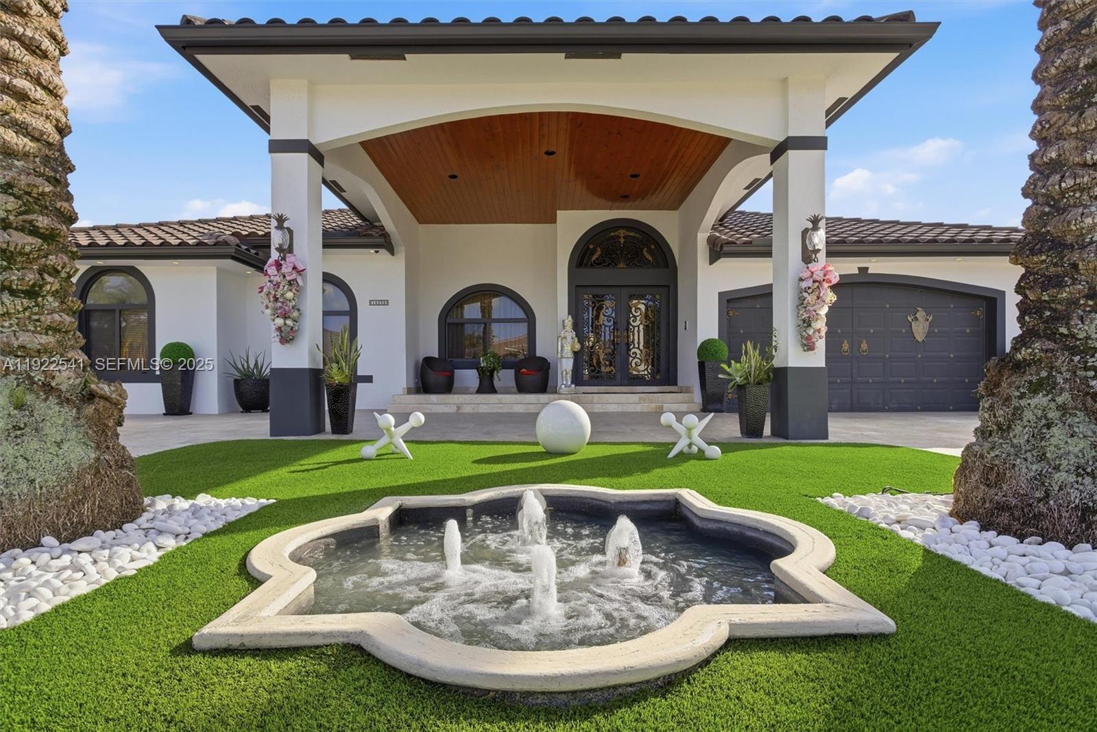 14252 Southwest 30th Street Miami, FL 33175 - Photo 48 of 60 a front view of a house with garden