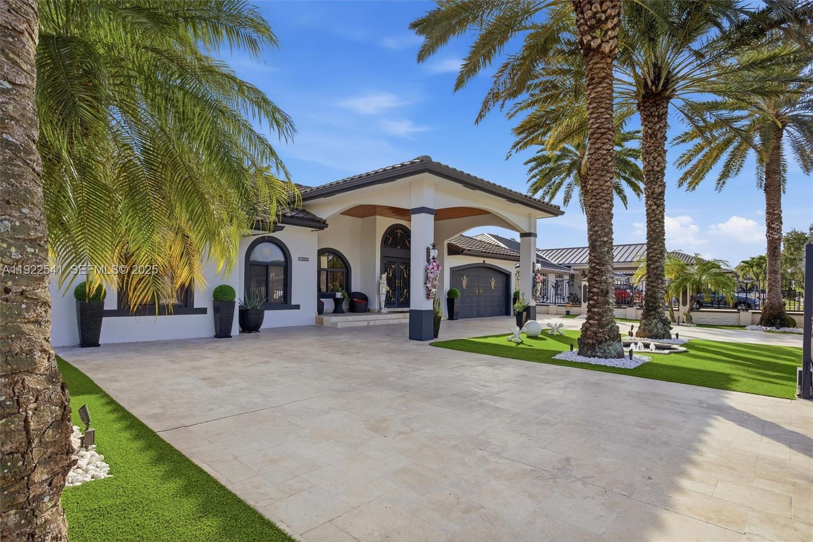 14252 Southwest 30th Street Miami, FL 33175 - Photo 50 of 60 a couple of palm trees in front of a house