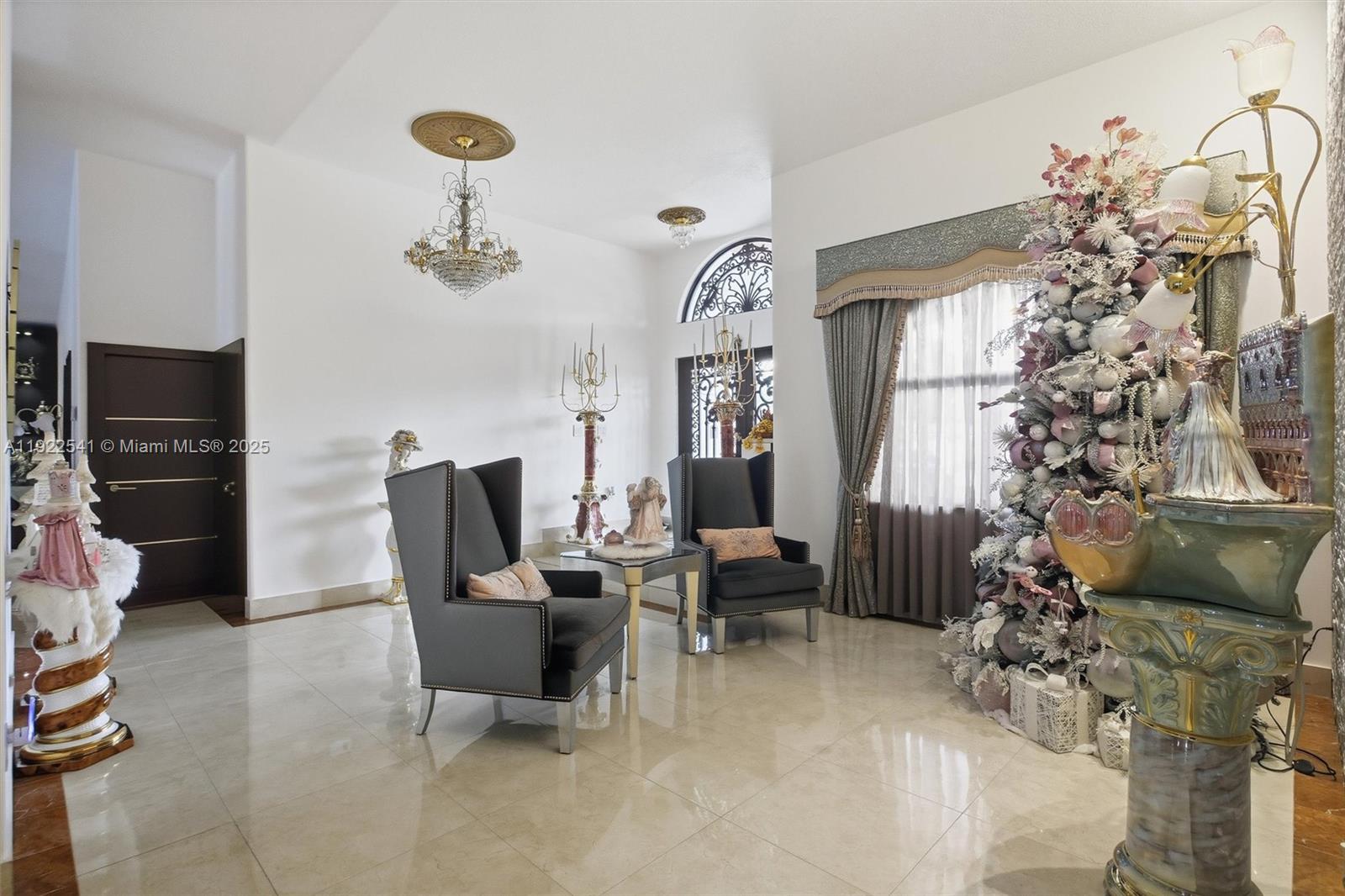 14252 Southwest 30th Street Miami, FL 33175 - Photo 5 of 60 a living room with furniture and a chandelier