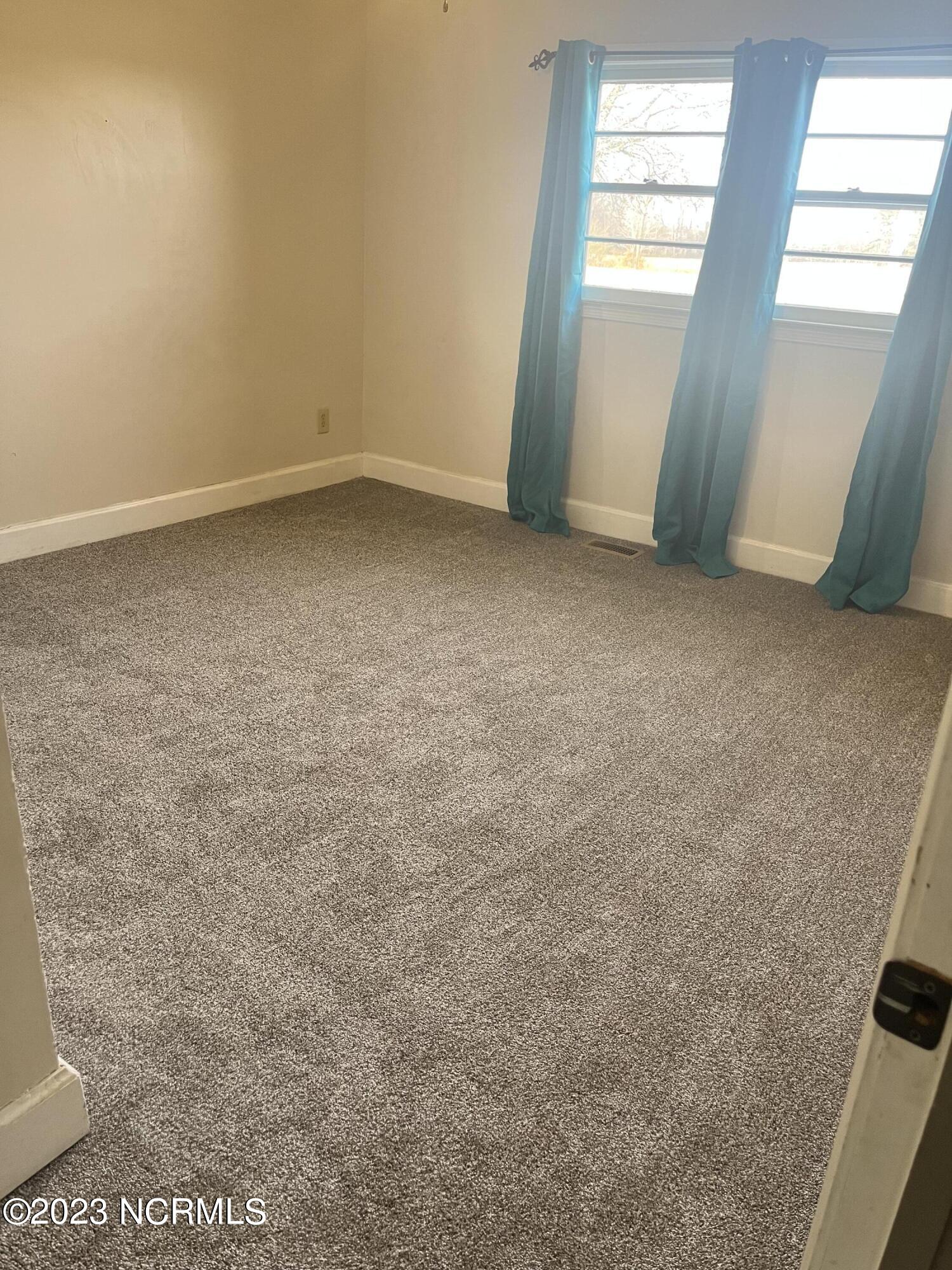 6759 Good News Church Road Stantonsburg, NC 27883 - Photo 12 of 54 #1 Bedroom with new carpet