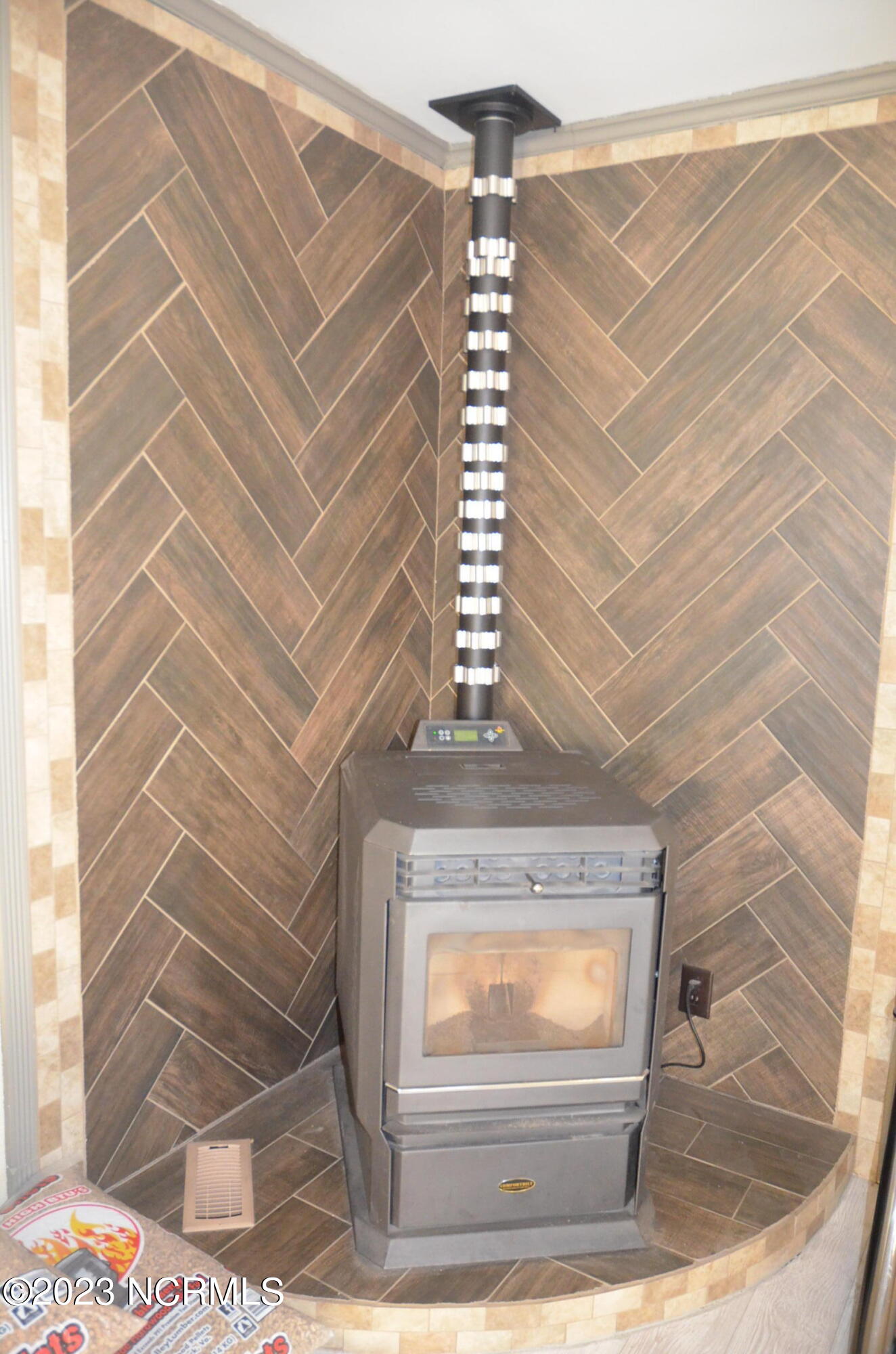 6759 Good News Church Road Stantonsburg, NC 27883 - Photo 18 of 54 Nice pellet stove in living room