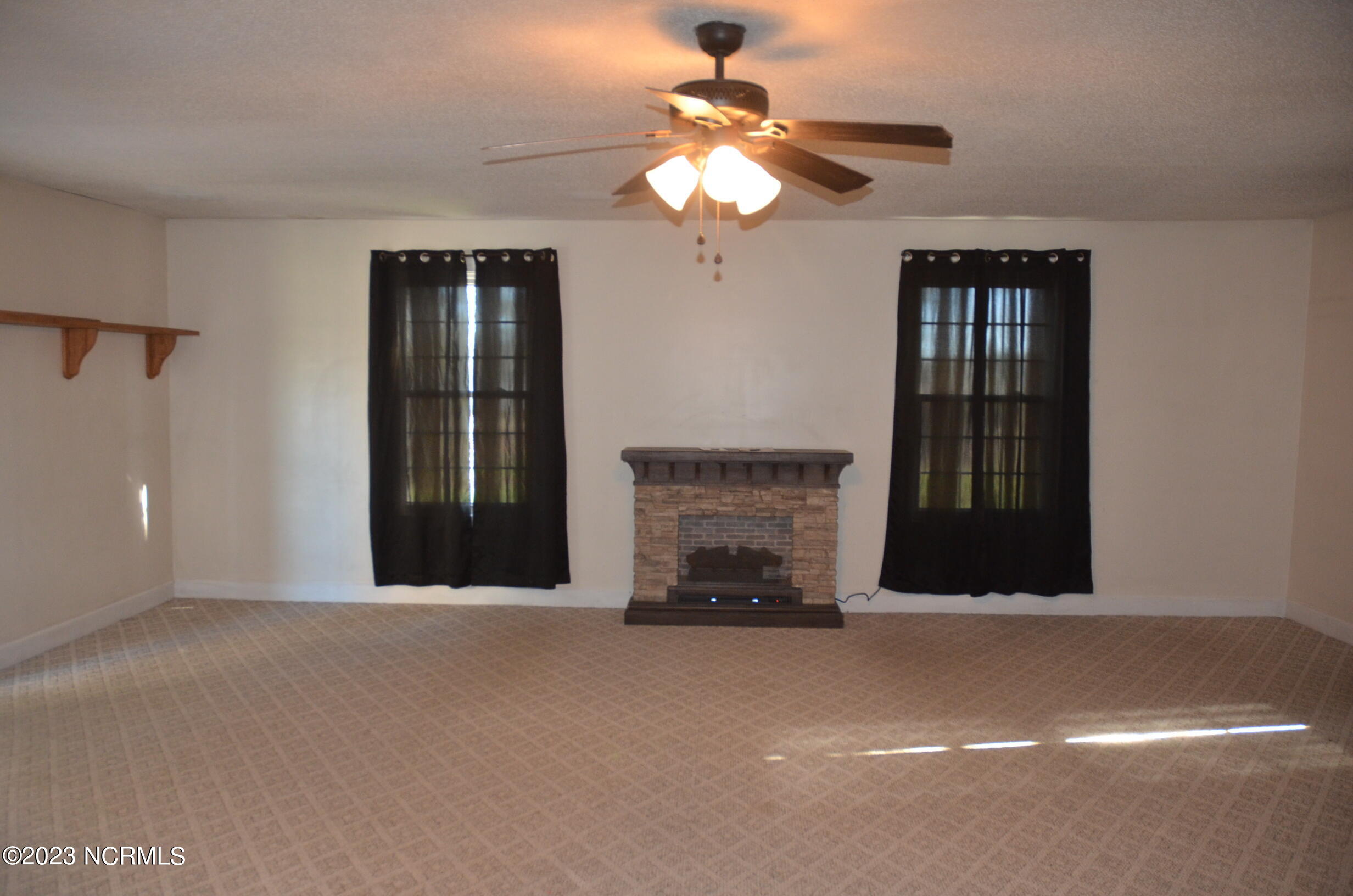 6759 Good News Church Road Stantonsburg, NC 27883 - Photo 31 of 54 Another view of Primary Bedroom showing electric fireplace