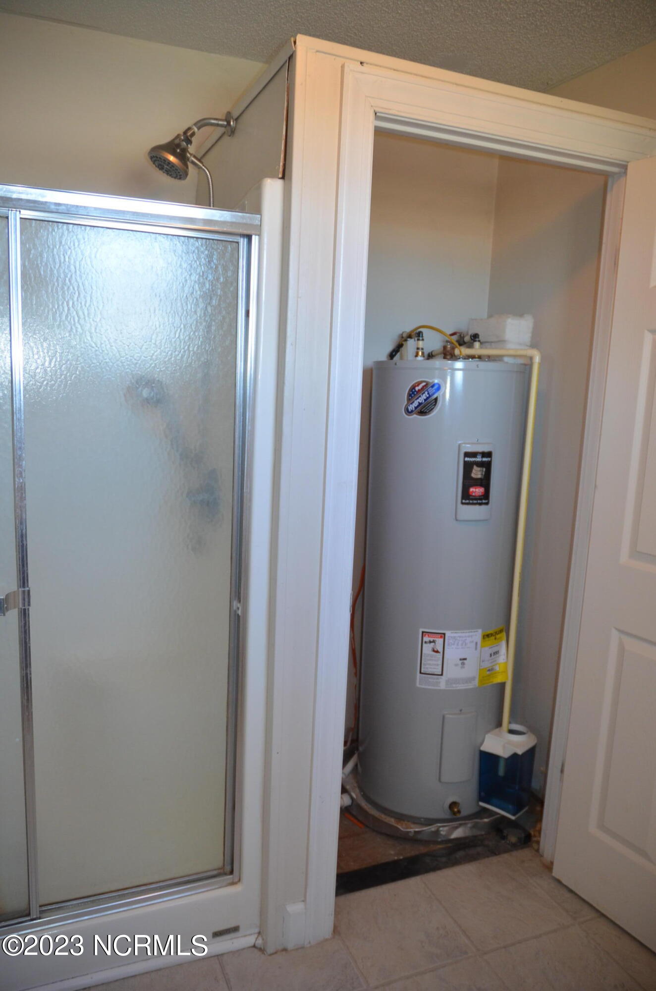 6759 Good News Church Road Stantonsburg, NC 27883 - Photo 36 of 54 Stand up showing in Primary bathroom showing second hot water tank
