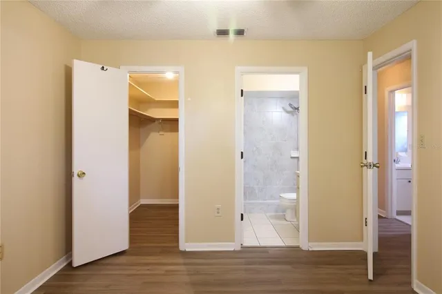 a view of a bathroom with a glass door and shower