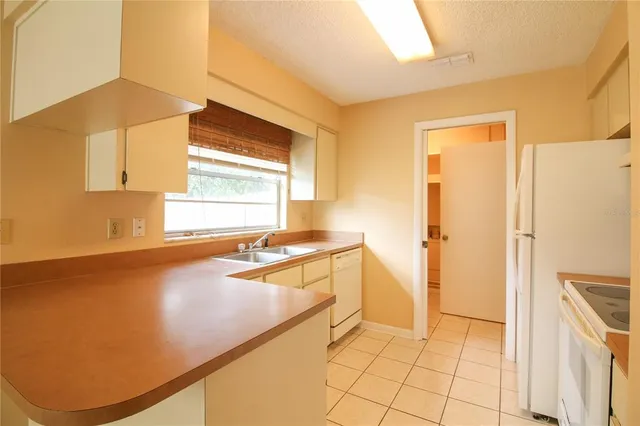 a spacious bathroom with a tub and a sink