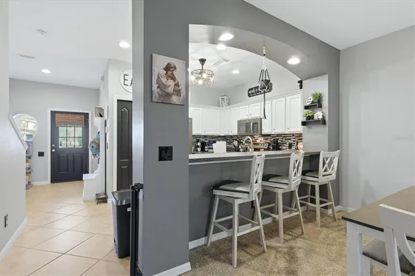a kitchen with a table and chairs in it