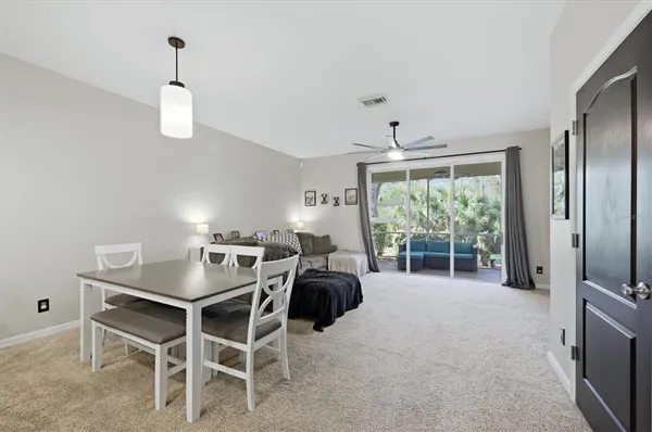 a dining room with furniture and window