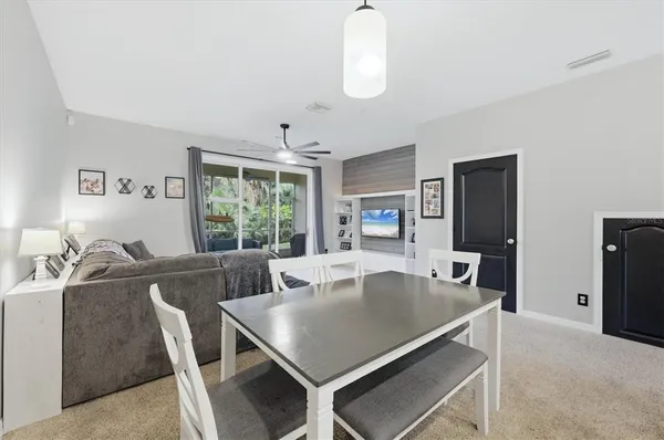 a view of a dining room with furniture window and outside view