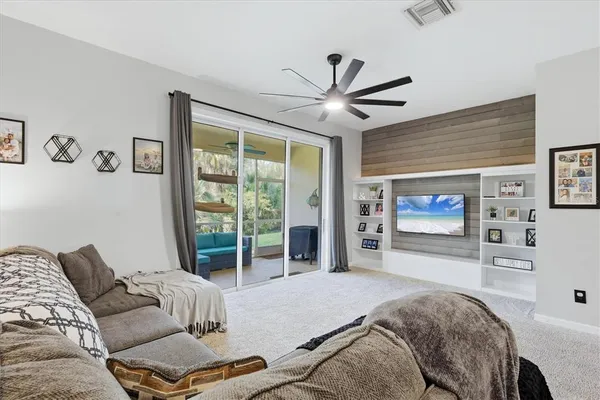 a spacious bedroom with a bed and a large window