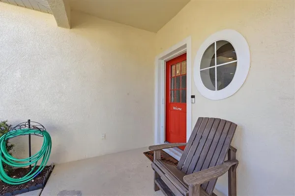 a front view of a house with a sink and mirror