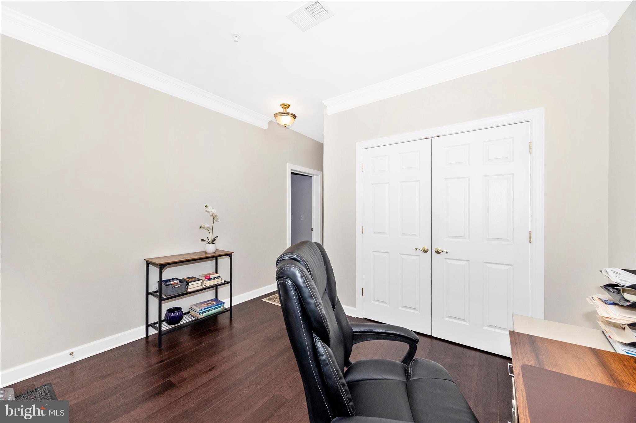 35 East All Saints Street, Unit 211 Frederick, MD 21701 - Photo 11 of 61 a view of livingroom with furniture and wooden floor