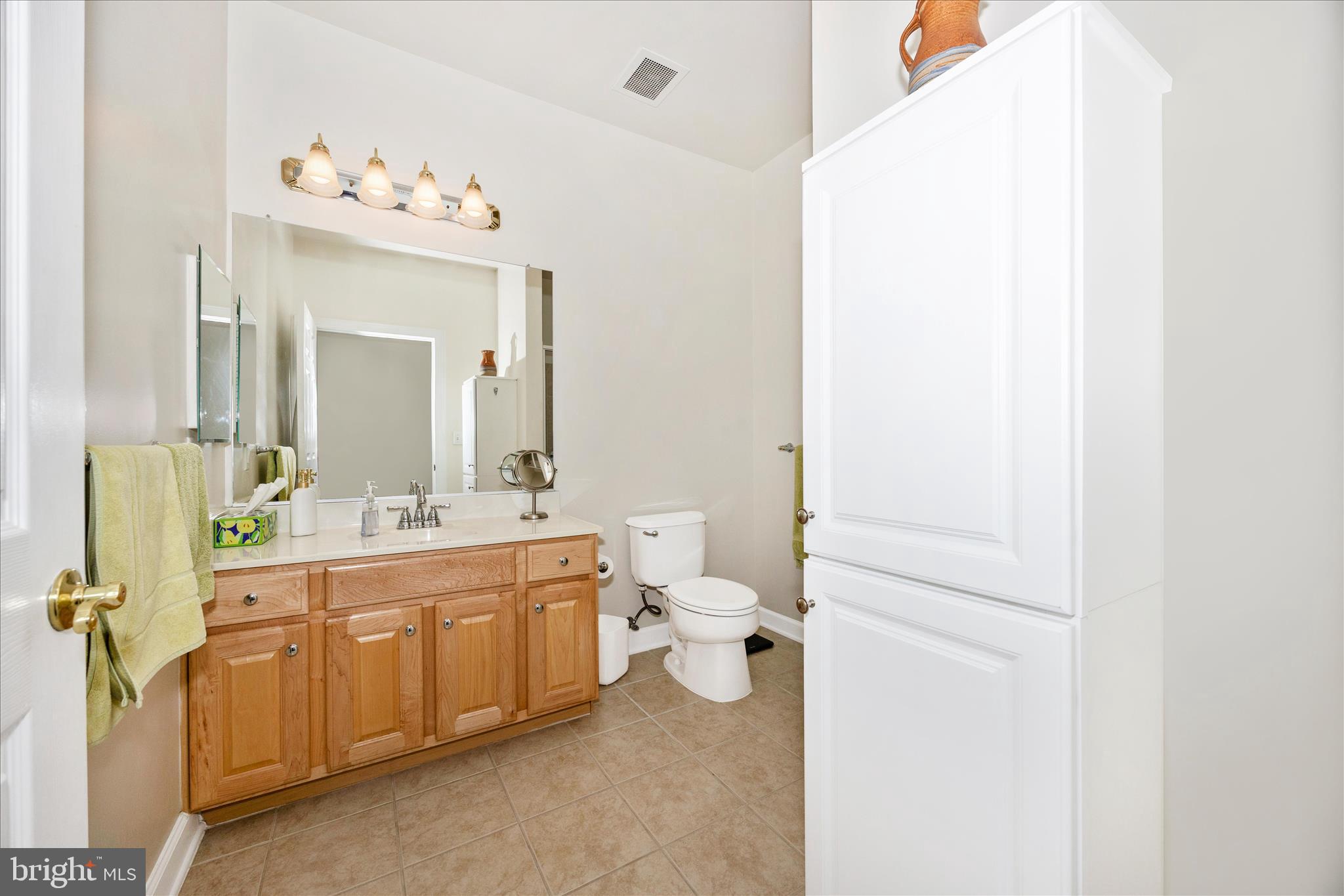 35 East All Saints Street, Unit 211 Frederick, MD 21701 - Photo 15 of 61 a spacious bathroom with a toilet sink and mirror