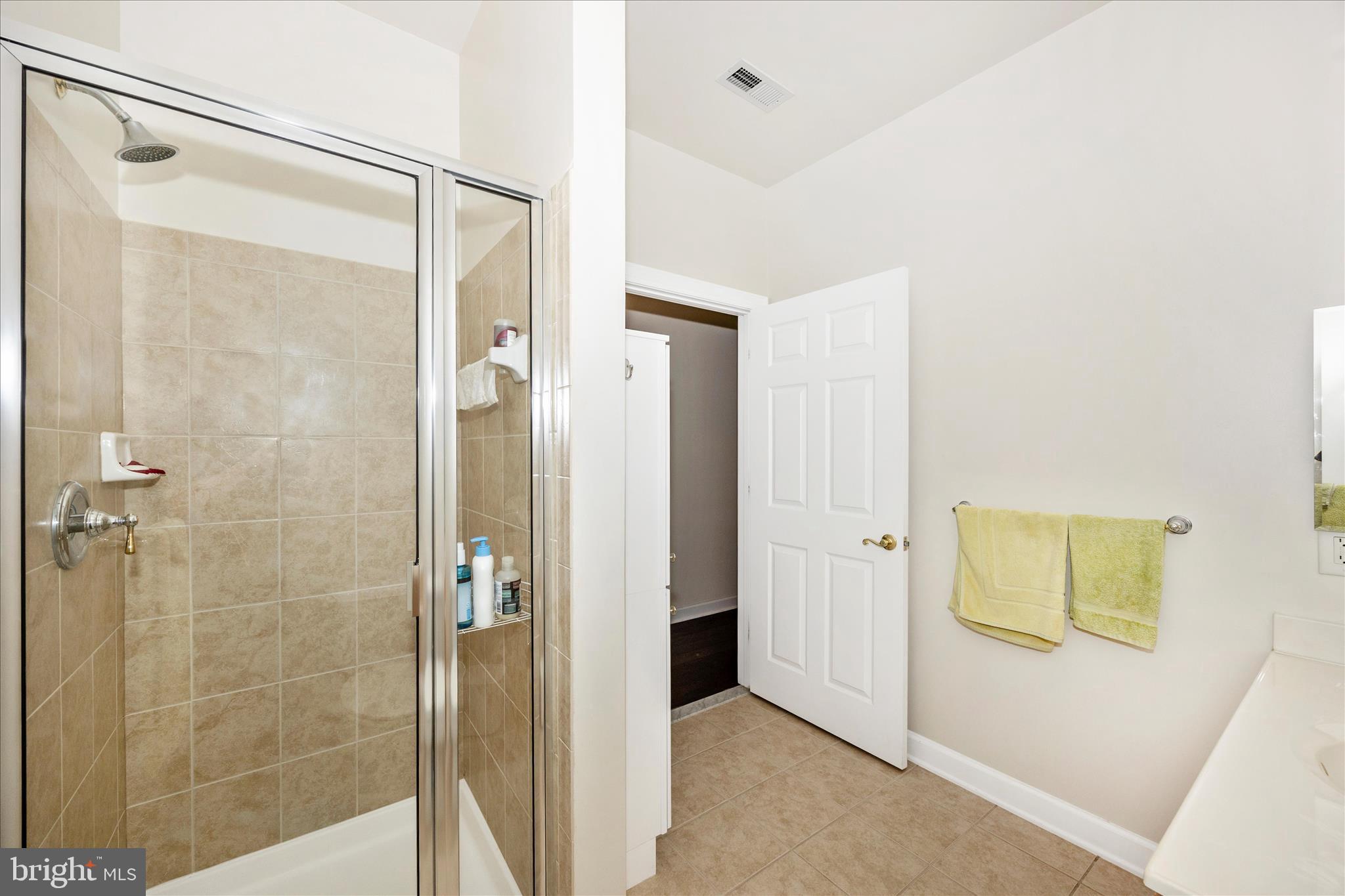 35 East All Saints Street, Unit 211 Frederick, MD 21701 - Photo 17 of 61 a bathroom with a glass shower door