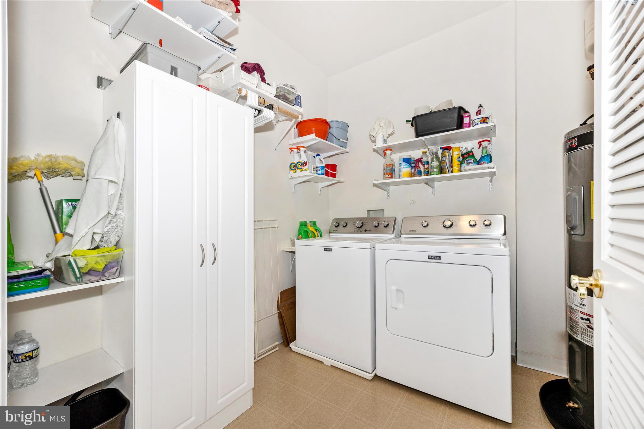 35 East All Saints Street, Unit 211 Frederick, MD 21701 - Photo 18 of 61 a utility room with fridge dryer and washer