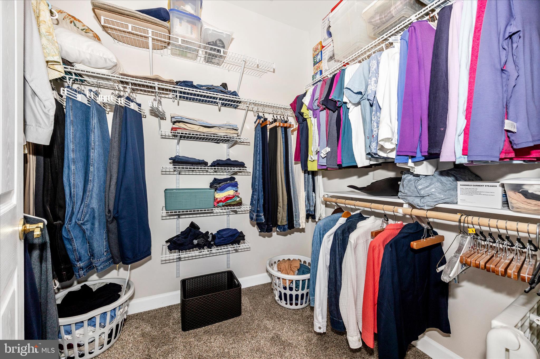 35 East All Saints Street, Unit 211 Frederick, MD 21701 - Photo 26 of 61 a view of walk in closet with clothes and shoes